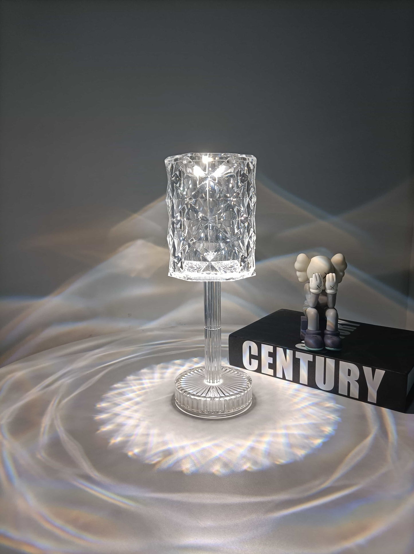 Crystal-diamond-lamp-table-touch-led-control-16-colours-lamp-on-table-next-to-book-illuminating-room